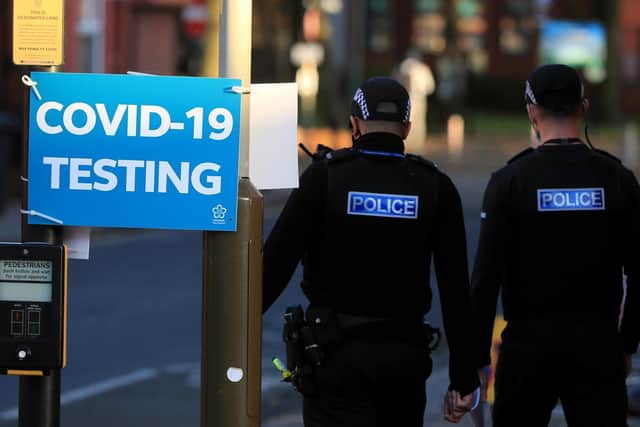 Police outside a Covid-19 testing centre in Leicester on the first day of a second lockdown on Thursday