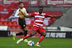 BRING IT ON: Doncaster's Fejiri Okenabirhie welcomes the number of games currently coming Rovers' way. Picture: Howard Roe/AHPIX.