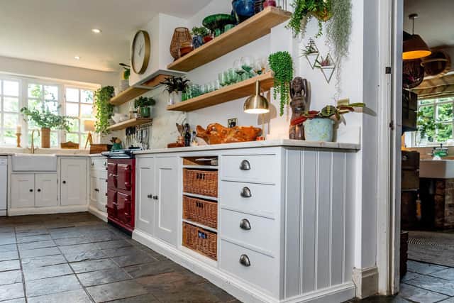 Pandora's kitchen is now a brighter, less cluttered space thanks to painting the cupboards in white and adding a white marble worktop plus open shelves