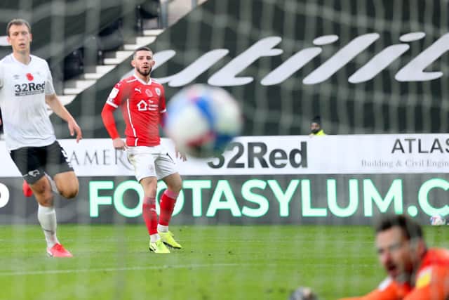 GOAL: Conor Chaplin watches his shot hit the back of net for Barnsley at Derby County. Picture: Alex Pantling/Getty Images.