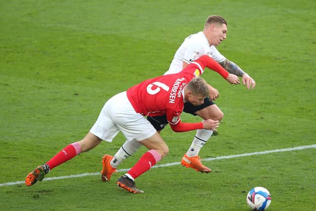 Derby County's Martyn Waghorn (right) and Barnsley's Mads Andersen battle for the ball (PIcture; PA)