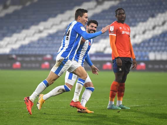 DUTCH OF CLASS: Carel Eiting wheels away in celebration after equalising for Huddersfield Town. Picture: Gareth Copley/Getty Images.
