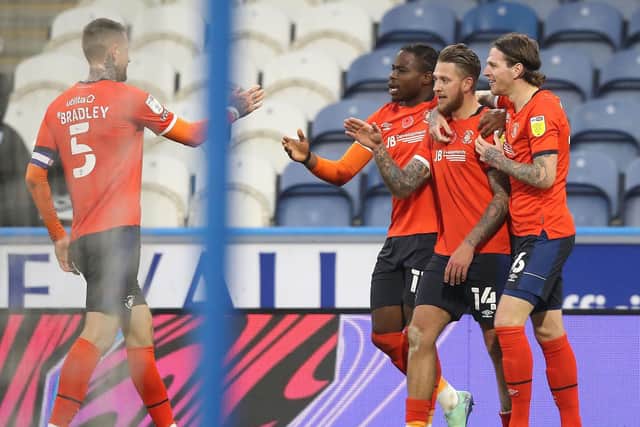 OPENER: George Moncur celebrates with his teammates after giving Luton Town a firsr-half lead. Picture:Martin Rickett/PA Wire.