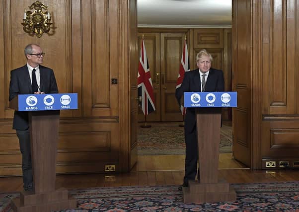 Chief scientific adviser Sir Patrick Vallance and Prime Minister Boris Johnson during the announcement of a second national lockdown for England. Picture: Alberto Pezzali/PA Wire