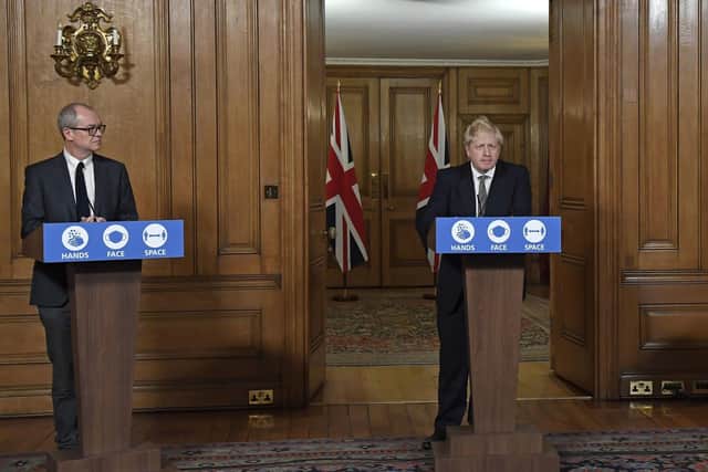 Chief scientific adviser Sir Patrick Vallance and Prime Minister Boris Johnson during the announcement of a second national lockdown for England. Picture: Alberto Pezzali/PA Wire