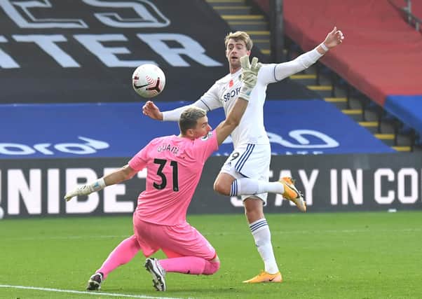 Patrick Bamford of Leeds United clips the ball over the advancing Crystal Palace goalkeeper Vicente Guaita only for the equalising goal to be chalked off by the video assistant referee for offside because Bamford’s outstretched arm had taken him beyond the last line of the defence.  (Picture: Getty Images)