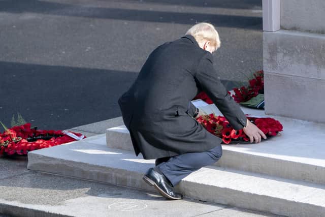 This was Boris Johnson laying his wreath on the steps of the Cenotaph.