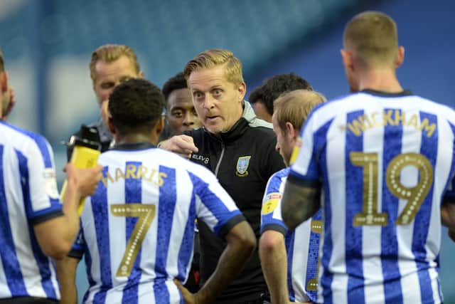 Garry Monk discusses tactics with his Sheffield Wednesday players towards the end of last season. Picture: Steve Ellis