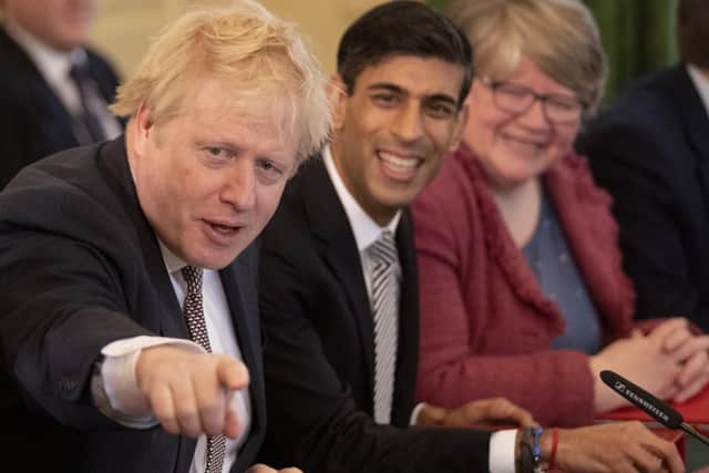 Work and Pensions Secretary Dr Therese Coffey in a pre-lockdown Cabinet meeting with Boris Johnson and Rishi Sunak.