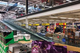 The travelator at a Tesco supermarket in Cambridge is blocked off to close the clothing and general merchandise department, at the start of the first full week of the four week national lockdown in England.