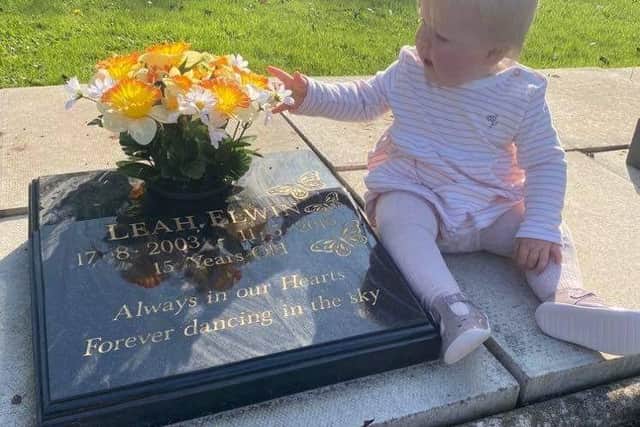 Leah's sister Ava, who was born after her death, at her grave