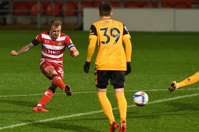 Doncaster's James Coppinger has a shot on goal. Picture: Andrew Roe/AHPIX LTD