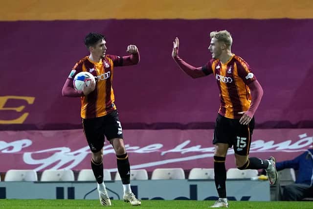 Bradford’s Jackson Longridge (left) and Tyler French celebrate after Oldham Athletic's Will Sutton (not pictured) scores an own goal. Picture: PA.