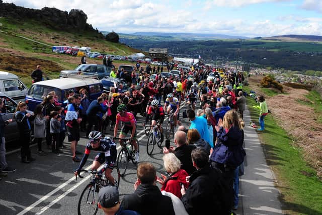 Sir Bradley Wiggins in the centre of the peloton of the Tour de Yorkshire make their way through the crowd past the Cow and Calf in Ilkley in the very first Tour de Yorkshire bacjk in 2015 (Picture: Tony Johnson)