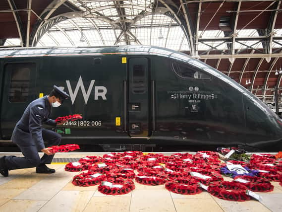 Military personnel carry poppy wreaths at Paddington Station in London, for 'Poppies to Paddington' which is transporting memorial wreaths from around the UK
Picture: Victoria Jones/PA Wire