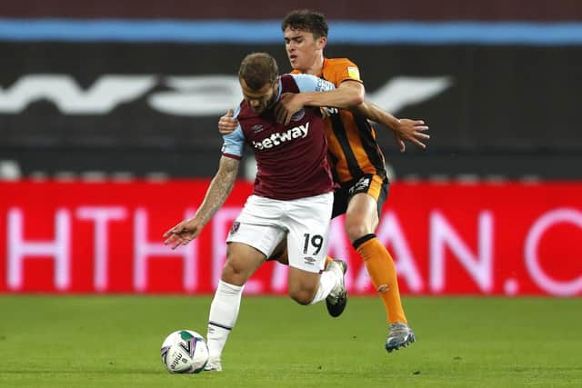West Ham United's Jack Wilshere (left) and Hull City's Callum Jones battle for the ball during the Carabao Cup third round match at the London Stadium in September (Picture: PA)