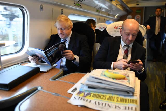 Downing Street director of communications Lee Cain (right) travelled with Boris Johnson by train to Telford last year to launch the Tory party's election manifesto.