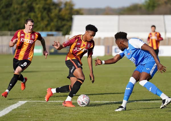 Contract extension: Bradford City's Bryce Hosannah taking on Tonbridge Angels' Kristian Campbell during the FA Cup first round. Picture: PA