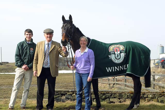Sue and Harvey Smith celebrate the Grand National success of Auroras Encore in 2013 with Ryan Mania. Photo: Gerard Binks.