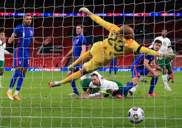 Republic of Ireland goalkeeper Darren Randolph dives in vain as England's Harry Maguire (second right) scores his side's first goal. Picture: PA