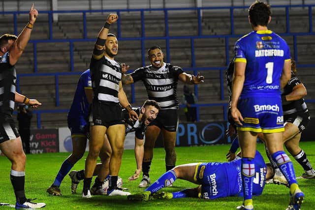 Hull FC's Jake Connor, third left, celebrates his late score that sealed the play-off win over Warrington Wolves. (PIC: JONATHAN GAWTHORPE)