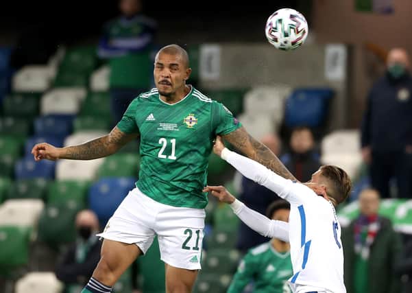 Battling: Northern Ireland's Josh Magennis and Slovakia's Peter Pekar’k. Picture: PA