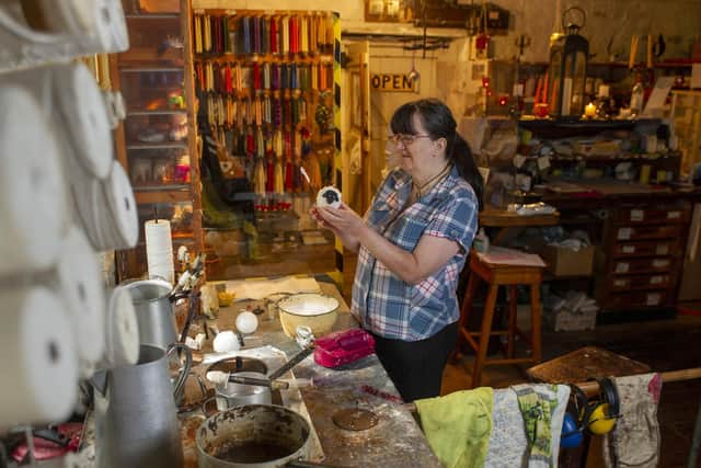 Sandra Hewitt making novelty sheep at White Rose Candles, which is based in a 14th century watermill. (Tony Johnson)