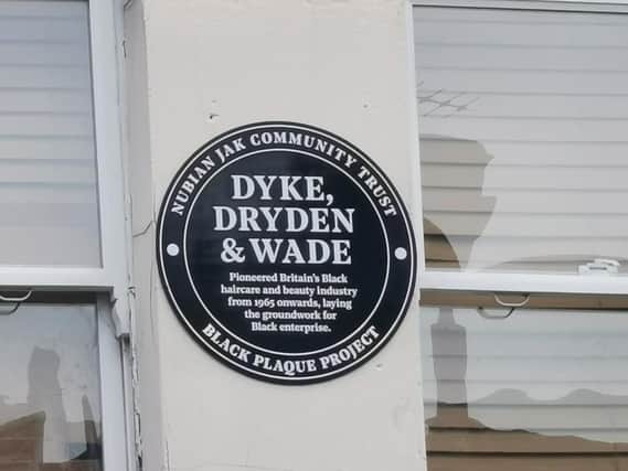The black plaque has been unveiled at the site of a wig and cosmetic shop in north London
