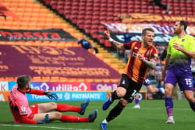 OPENER: Billy Clarke wheels away in celebration after scoring Bradford's first goal against Exeter. Picture: George Wood/Getty Images.