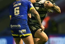 DIFFERENCE MAKER: Hull FC's Josh Griffin fends off Warrington's Blake Austin during Thursday's play-off clash. Picture: Jonathan Gawthorpe