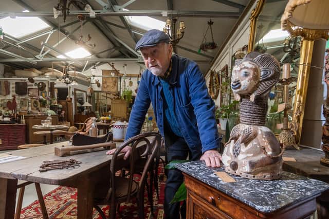 Stephen Hazell, owner of The French House, surrounded by French Antiques in his York warehouse.