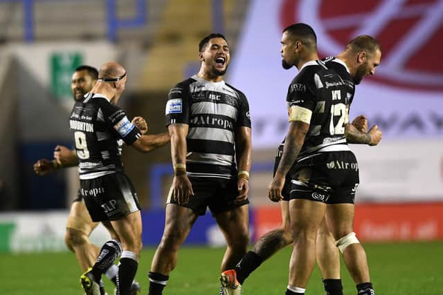 Hull FC's Bureta Faraimo, middle, starts the celebrations as his side defeat Warrington Wolves to get within 80 minutes of a Grand Final. (JONATHAN GAWTHORPE)