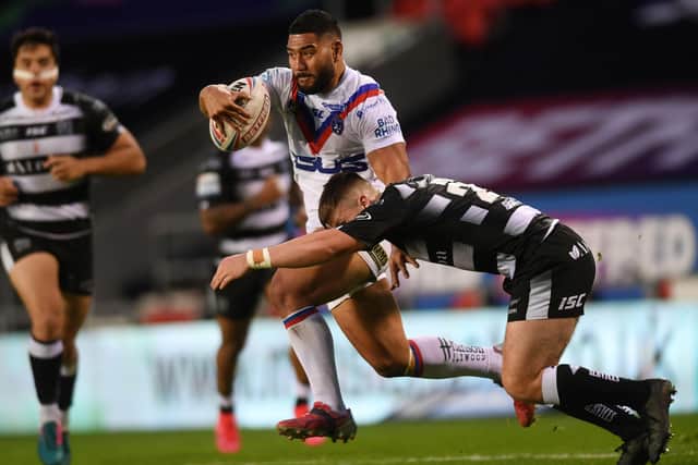 CENTRE PIECE: Wakefield Trinity's Kelepi Tanginoa battles with Hull FC's Connor Wynne. 
Picture: Jonathan Gawthorpe.