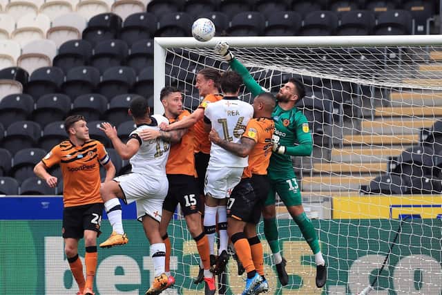 Hull City goalkeeper Matt Ingram punches clear whilst under pressure (Picture: PA)
