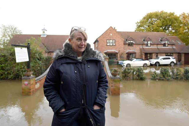 Pam Webb outside Truffle Lodge, her home in Fishlake, after the River Don burst its banks. Ms Webb was among those to find a flood exclusion had been added to her insurance policy. Joe Giddens/PA Wire