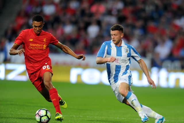 Harry Bunn, in action for Huddersfield Town against Liverpool's Trent Alexander-Arnoldduring a pre-season friendly in July 2016. Picture: Tony Johnson.