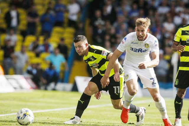 Huddersfield Town's Harry Bunn (left) and Leeds United's Charlie Taylor battle for the ball at Elland Road back in September 2016. Picture:: Danny Lawson/PA