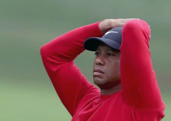Nightmare: Former champion Tiger Woods scored a 10 on the par three 12th hole - the highest single-hole score of his entire career. (Curtis Compton/Atlanta Journal-Constitution via AP)