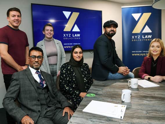 Anis Dadu, front left, has launched his own law firm called XYZ Law.