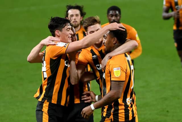 IN-FORM: Striker Mallik Wilks is congratulated after scoring the opening goal for Hull City against Burton on Saturday. Picture: Simon Hulme