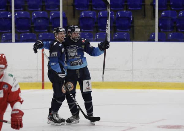 Ben Lake and Alex Graham, right, celebrate the youngster's second goal against Swindon on SYnday at Ice Sheffield. Picture: Cerys Molloy.