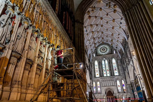 York Minster's once-a-century project to refurbish its Grand Organ is entering its final phase, as work to clean the newly revealed Pulpitum, known as the Kings Screen, nears completion and the process to voice the instrument's pipes begins. Pictured Lee Godfrey, Mason Conservator from the York Minster Works Department pointing the finishing touches to this major restoration work. Image: James Hardisty