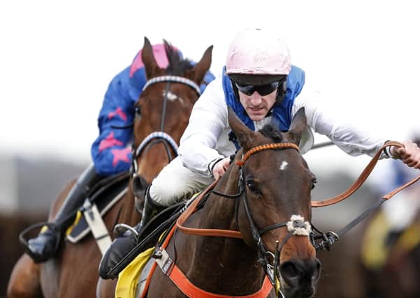 Brian Hughes riding Waiting Patiently (R) clear the last to win The Betfair Ascot Steeple Chase at Ascot in 2018 (Picture: Alan Crowhurst/Getty Images)