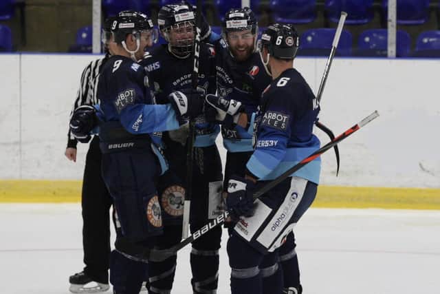 PROMISING START: Sheffield Steeldogs' players celebrate a goal during their win over Swindon. Picture: Cerys Molloy.
