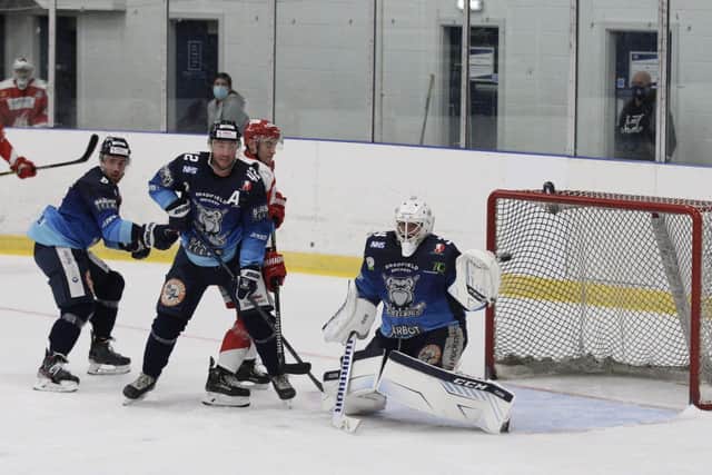 Ben Morgan, left, and Ben O'Connor watch on as Sheffield Steeldogs' Dimitri Zimozdra glove saves a Swindon effort. Picture: Cerys Molloy.