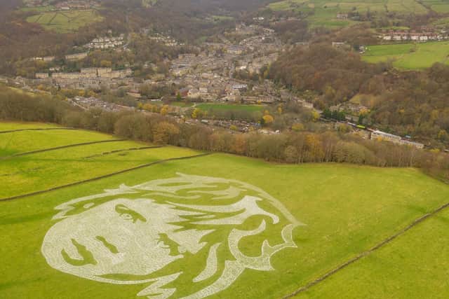 Hebden Bridge-based company Sand In Your Eye have created a huge 110m-wide  image made up of 6000 life size figures of playing children, that when viewed from the sky forms a childs face. Photo credit: Sand In Your Eye
