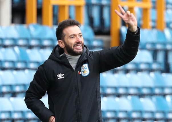 Huddersfield Town coach Carlos Corberan: Hectic schedule.
