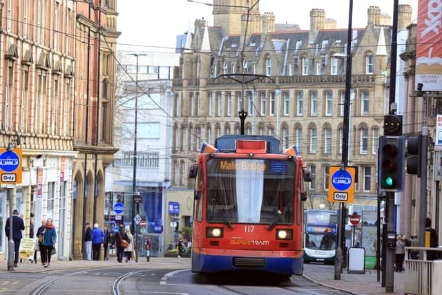 A tram runs through the centre of Sheffield.