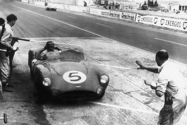 A works Aston Martin DBR1/300 stops at the pits during the 24 Hours of Le Mans, at the Circuit de la Sarthe, France, 20th-21st June 1959. The car, driven by Carroll Shelby and Roy Salvadori won the race by one lap from teammates Paul Frere and Maurice Trintignant. (Photo by Central Press/Hulton Archive/Getty Images)