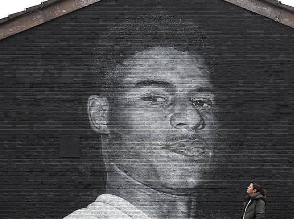 A mural of Manchester United striker Marcus Rashford by Street artist Akse on the wall of the Coffee House Cafe in Withington. (PA).